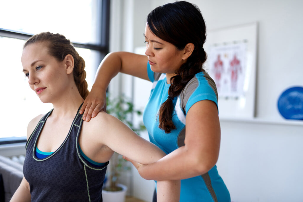 Woman Chiropractor Adjusting Extremity