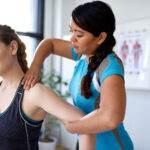 Woman Chiropractor Adjusting Extremity